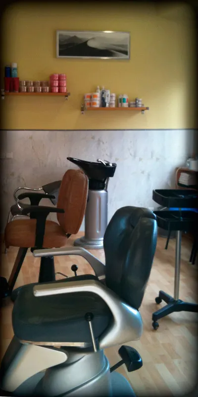 Cadira de barber i rentacaps de la perruqueria